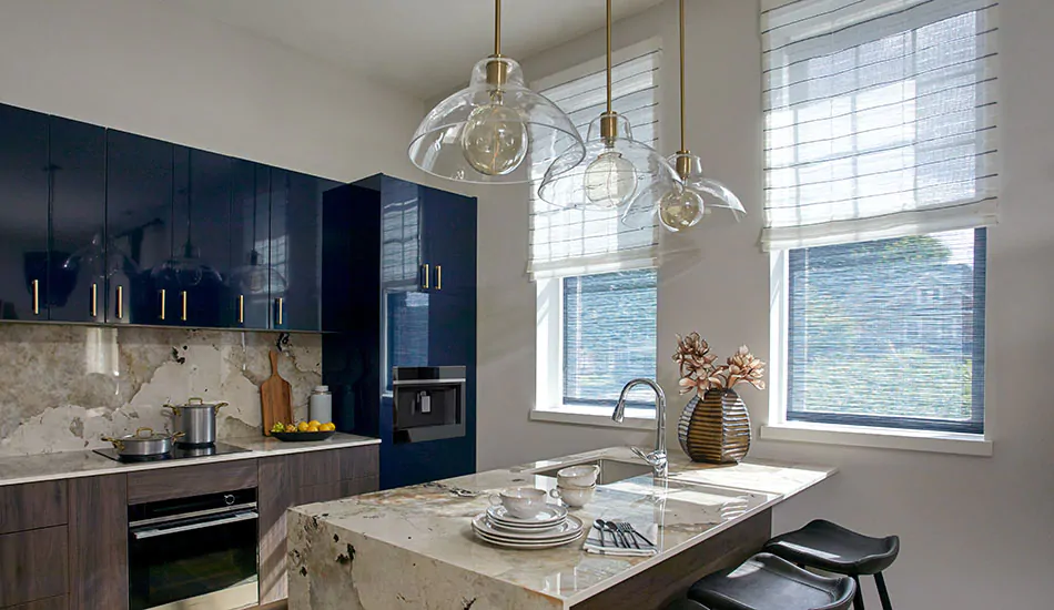 Contemporary window shades in a urban kitchen include flat roman shades with a neutral color and subtle stripe pattern