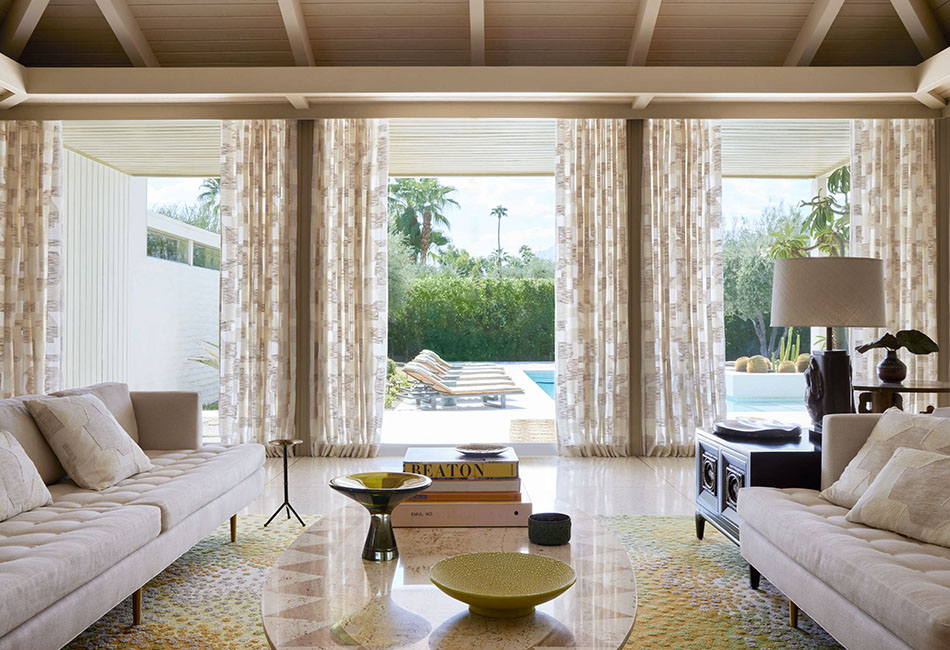 Living room curtain ideas for a modern boho transitional space including sheer drapes on doors that lead to a pool