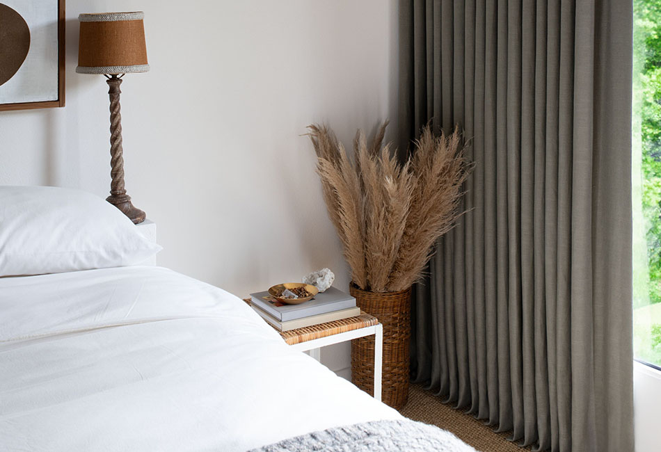 Ripple Fold Drapery in Lisbon Woven Agave brings an earthy, grounded look to a warm neutral guest bedroom.