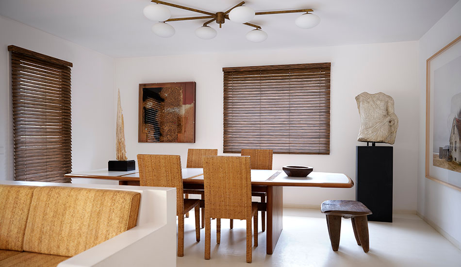 Wood Blinds made of Exotic wood in Zebrano suit a modern dining room, showing the difference between blinds vs drapery