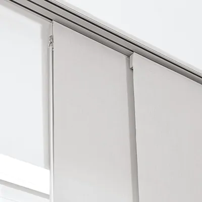 A close-up of a baton hanging from the top of vertical blinds in a panel track system showing how to pull window blinds down