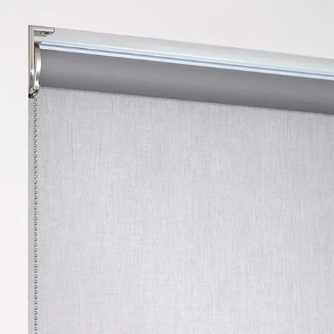 A product image of a regular roll shade with material falling off the back of the tube