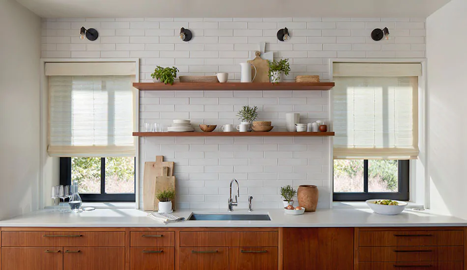 A modern farmhouse kitchen features woven wood shades with a soft valance showing the difference between a cornice vs valance